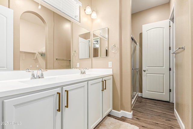1367 S Country Club Dr Unit 1331, Mesa, AZ 85210 - full bathroom with wood finished floors, double vanity, and a shower with shower door