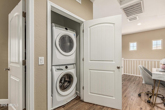 1367 S Country Club Dr Unit 1331, Mesa, AZ 85210 - washroom featuring stacked washer and clothes dryer and wood finished floors