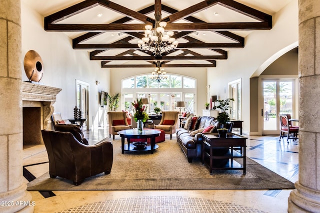 1367 S Country Club Dr Unit 1331, Mesa, AZ 85210 - living area featuring a towering ceiling, arched walkways, beam ceiling, a chandelier, and a premium fireplace