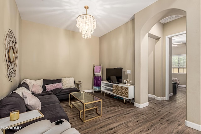 1367 S Country Club Dr Unit 1331, Mesa, AZ 85210 - living room with arched walkways, dark wood-style flooring, and a chandelier