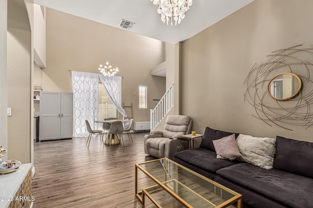 1367 S Country Club Dr Unit 1331, Mesa, AZ 85210 - living room with a chandelier, wood finished floors, stairs, and a towering ceiling