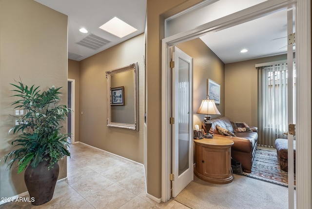 hallway with light tile patterned flooring