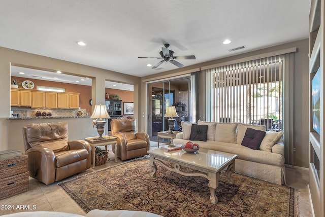 living room with ceiling fan and light tile patterned floors