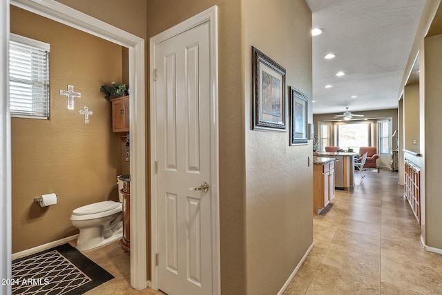 hallway featuring light tile patterned flooring