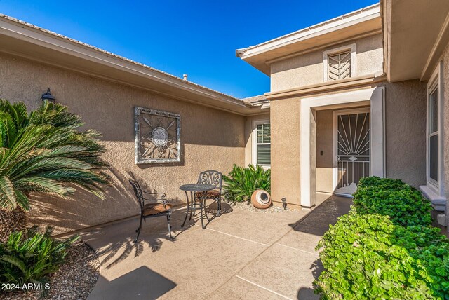 entrance to property with a patio area