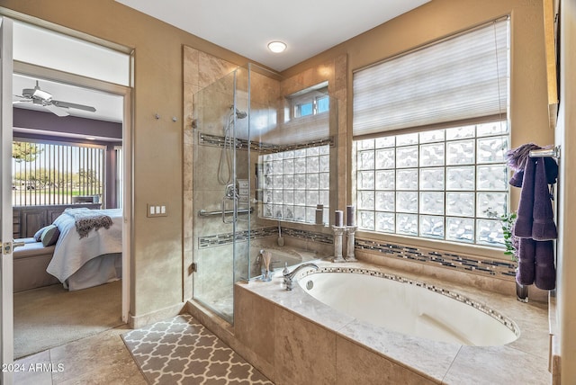 bathroom with separate shower and tub, ceiling fan, and a healthy amount of sunlight