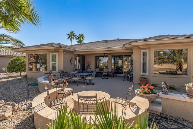 rear view of property featuring a patio area