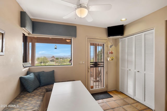 interior space with a ceiling fan