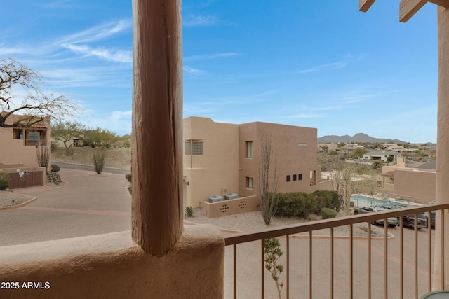 exterior space with a residential view and a mountain view