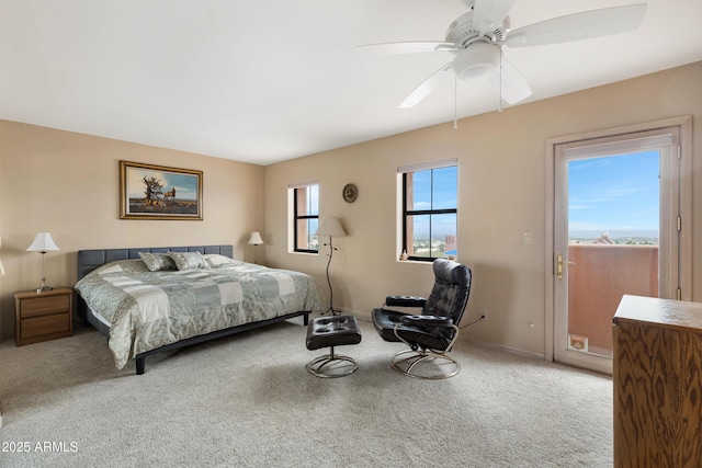 carpeted bedroom featuring a ceiling fan, baseboards, and access to outside