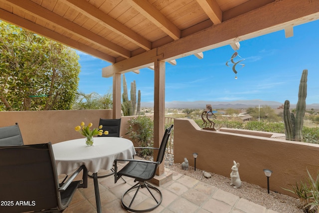 view of patio / terrace with a mountain view