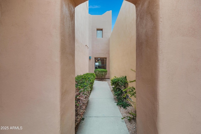 doorway to property with stucco siding