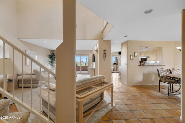 stairs featuring tile patterned flooring and baseboards