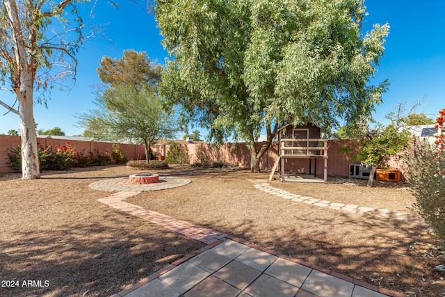 view of yard with an outdoor fire pit