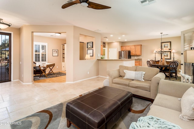 living room featuring ceiling fan