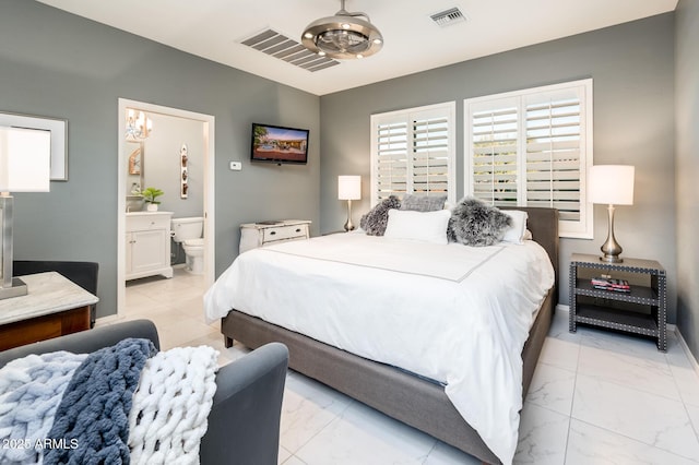 bedroom featuring ensuite bathroom