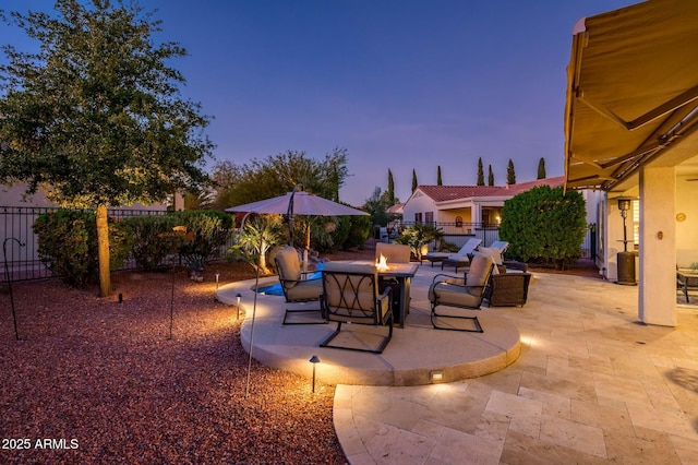 patio terrace at dusk with a fire pit