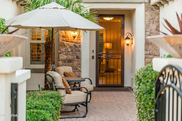 doorway to property with a patio