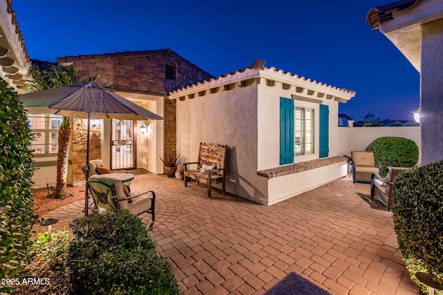 view of patio at night