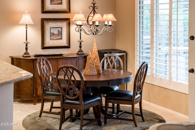 dining space featuring a notable chandelier