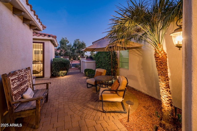 view of patio terrace at dusk