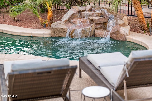 view of pool featuring pool water feature