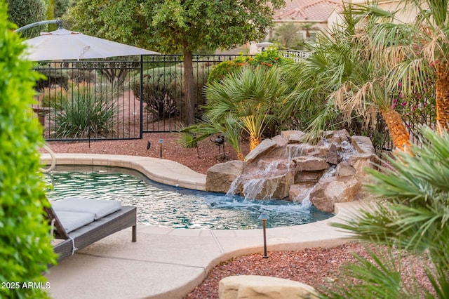 view of swimming pool featuring pool water feature