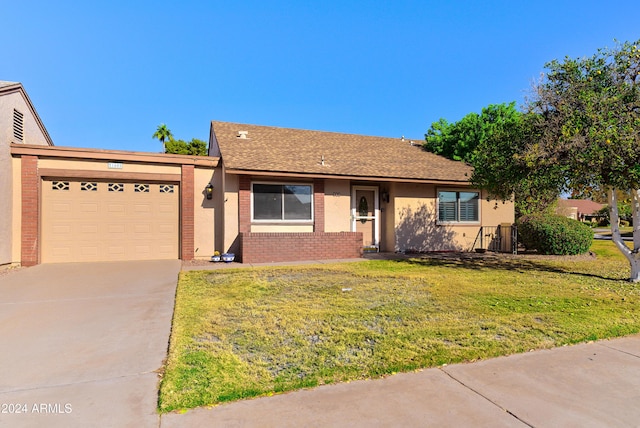 ranch-style house with a front yard and a garage