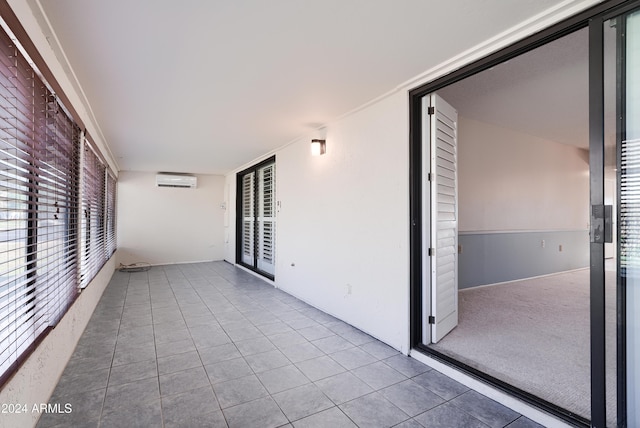 interior space featuring a wall mounted air conditioner and a balcony