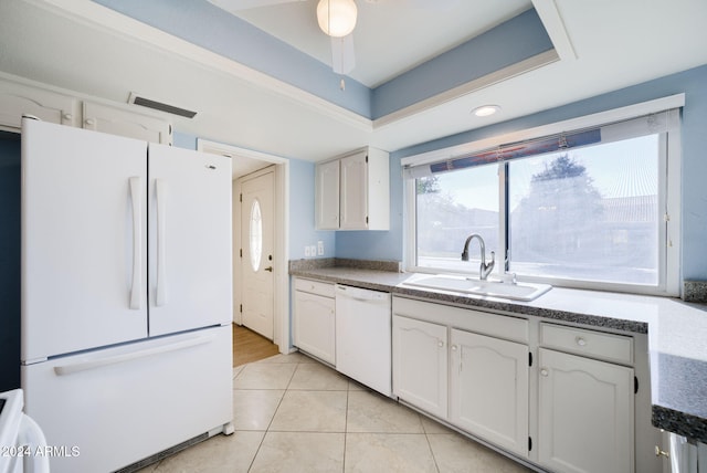 kitchen featuring white cabinets, white appliances, sink, and light tile patterned floors