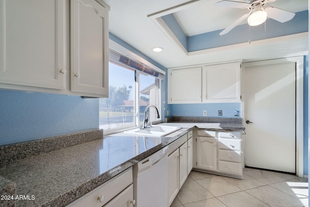 kitchen featuring ceiling fan, sink, light tile patterned floors, dishwasher, and white cabinetry