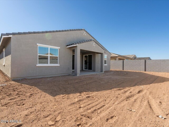 rear view of house with a patio area