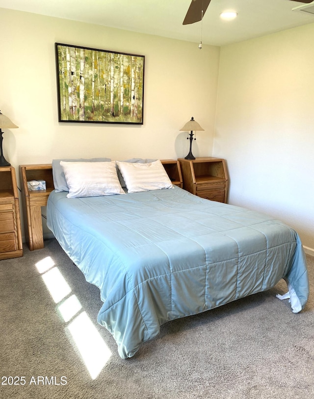 carpeted bedroom with a ceiling fan