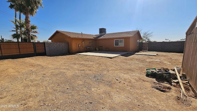 rear view of property featuring a patio and central air condition unit