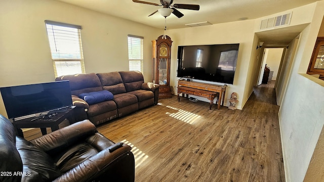 living room featuring hardwood / wood-style flooring and ceiling fan