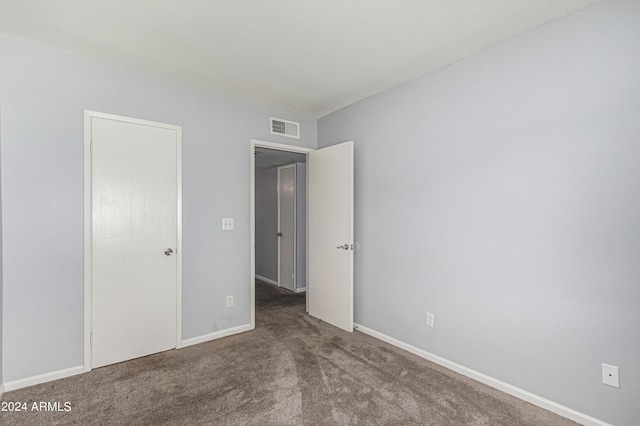 unfurnished bedroom with carpet