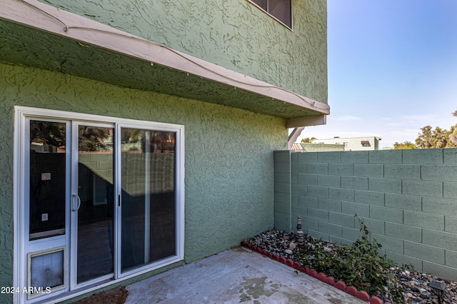 view of side of property featuring a patio area