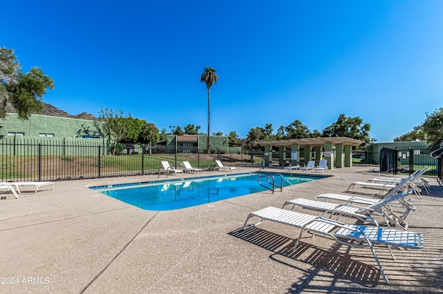 view of pool with a pergola and a patio area