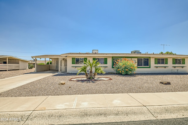 single story home with a carport