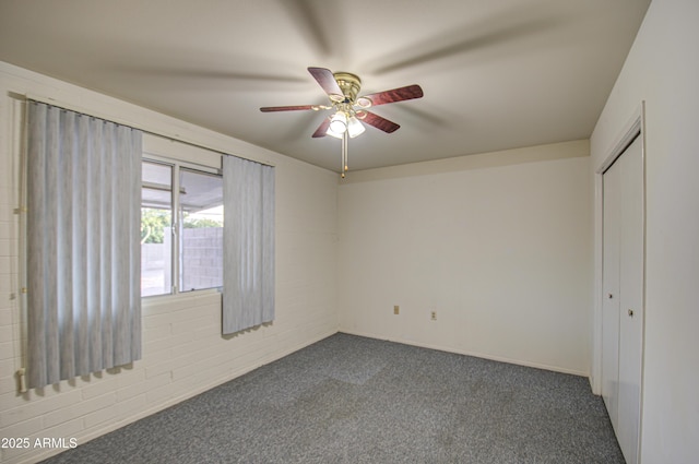 unfurnished bedroom featuring a closet, ceiling fan, and carpet floors