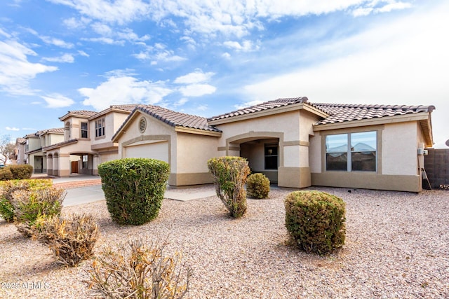 mediterranean / spanish-style home featuring a garage