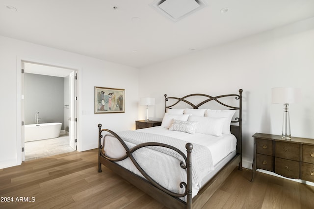 bedroom with hardwood / wood-style floors