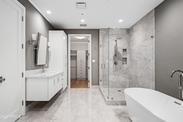 bathroom with vanity and plus walk in shower