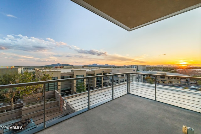 view of balcony at dusk