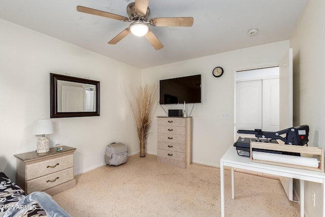 bedroom featuring speckled floor, baseboards, and a ceiling fan