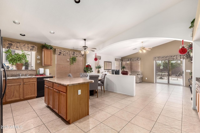 kitchen featuring ceiling fan, lofted ceiling, open floor plan, and light tile patterned floors