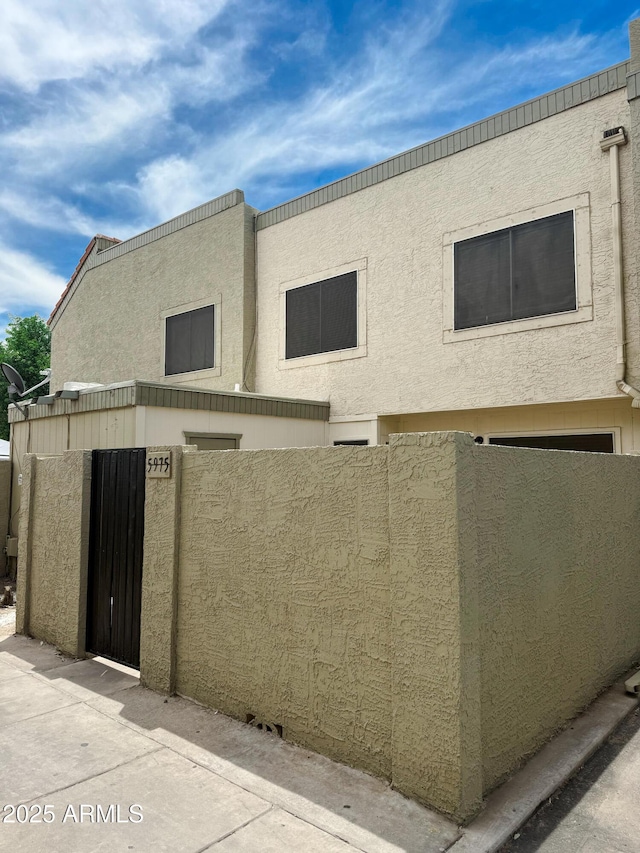 5975 N 48th Dr, Glendale, AZ 85301 - view of front facade with a gate and stucco siding