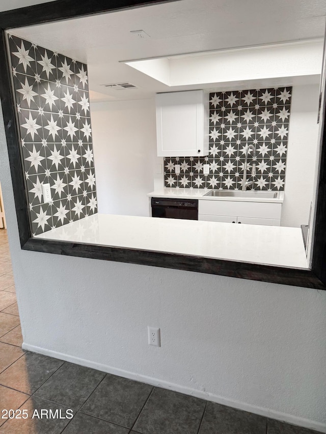 5975 N 48th Dr, Glendale, AZ 85301 - kitchen featuring dishwasher, a sink, white cabinets, and tile patterned floors