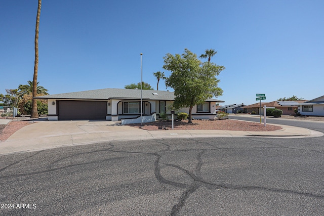 ranch-style house featuring a garage