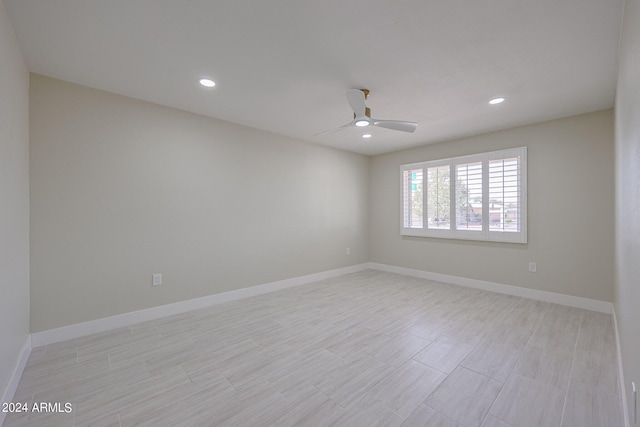 spare room with ceiling fan and light hardwood / wood-style floors